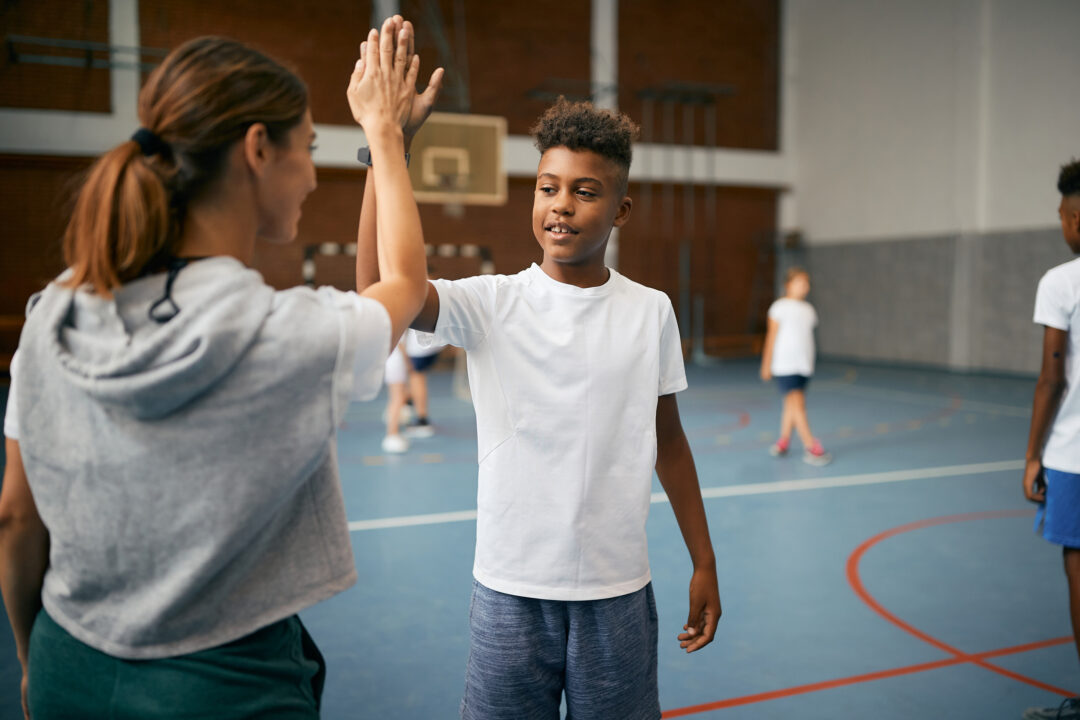boy-giving-high-five-to-pe-teacher
